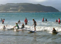 Kiwi students learn to surf at Piha Beach Image learningtosurf.jpg