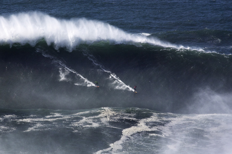 Carlos Burle and Rodrigo Koxa share a party wave in Nazaré Image burlekoxapartywave.jpg